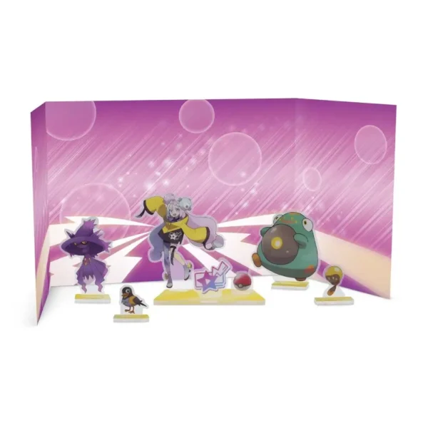 Figuras acrílicas montadas de Iono y su equipo con fondo rosado incluido en la colección